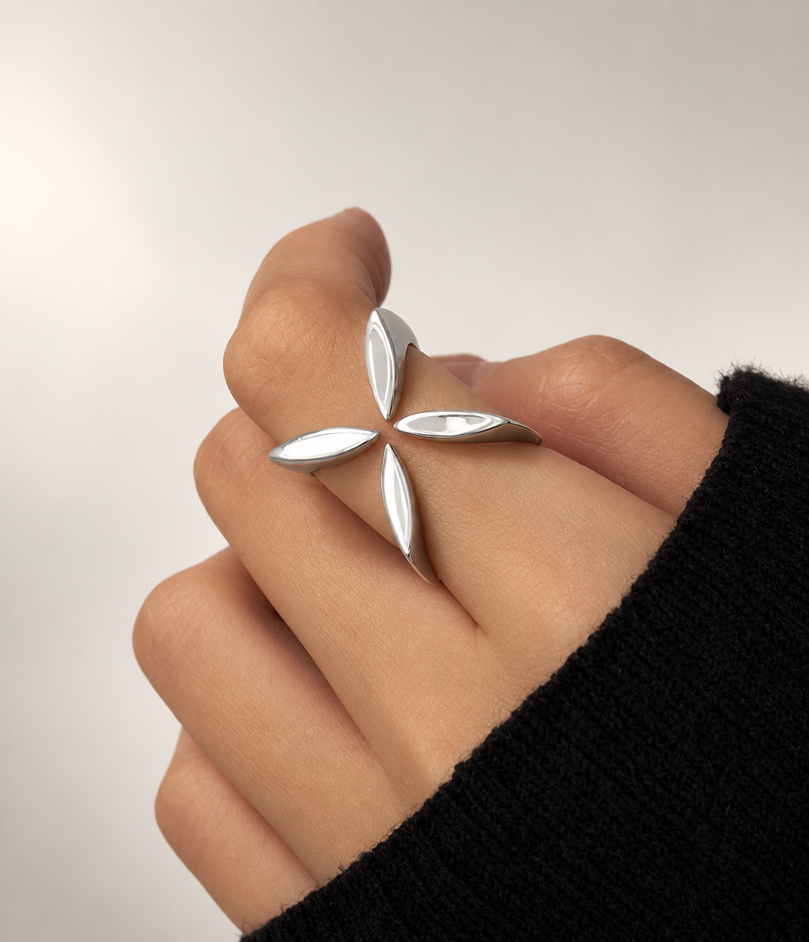 The Amaris Ring in sterling silver on a hand in a black knit sleeve against a pale backdrop
