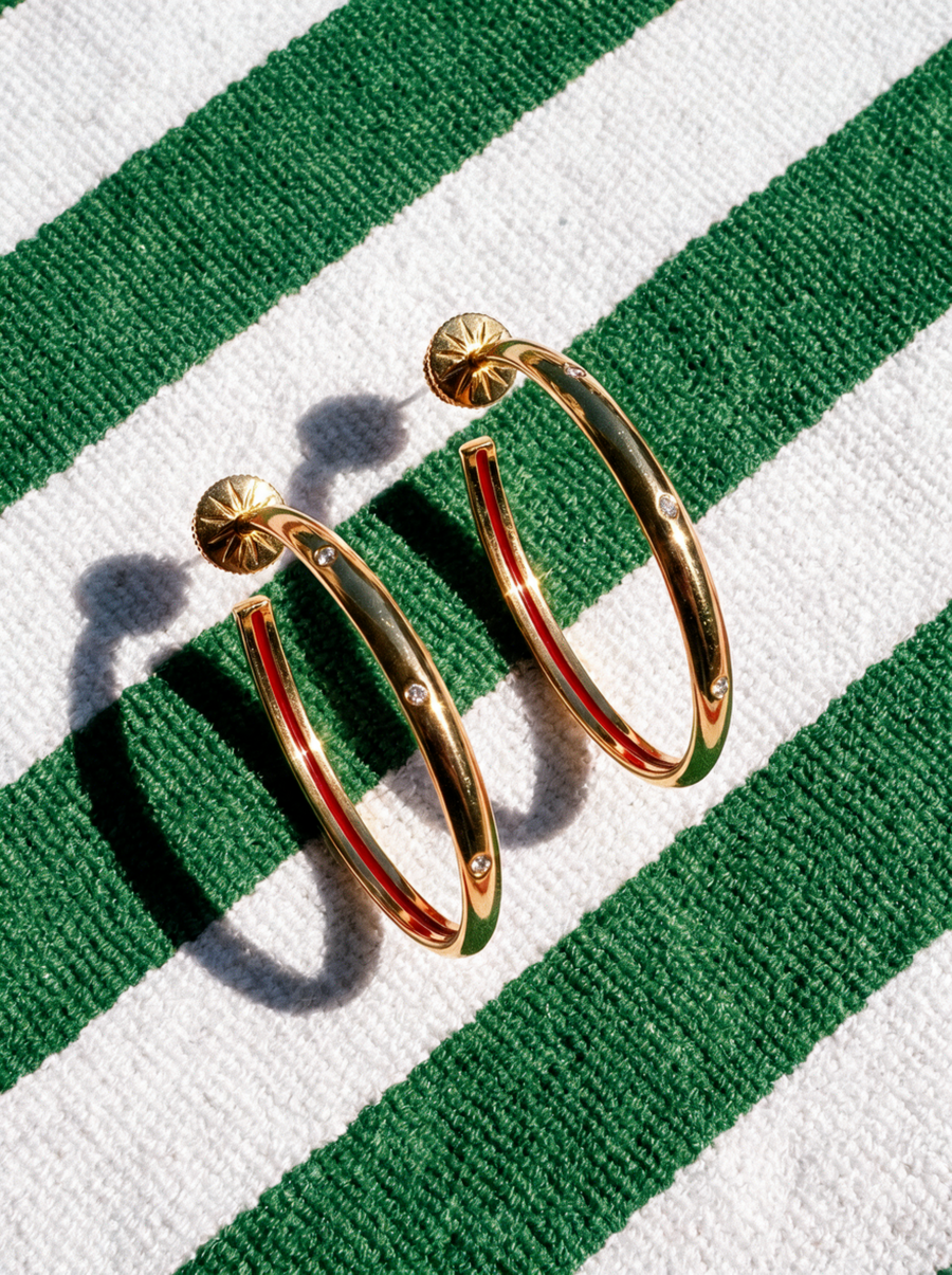 Fine Line Hoops with a red inner edge on a green and white striped cloth