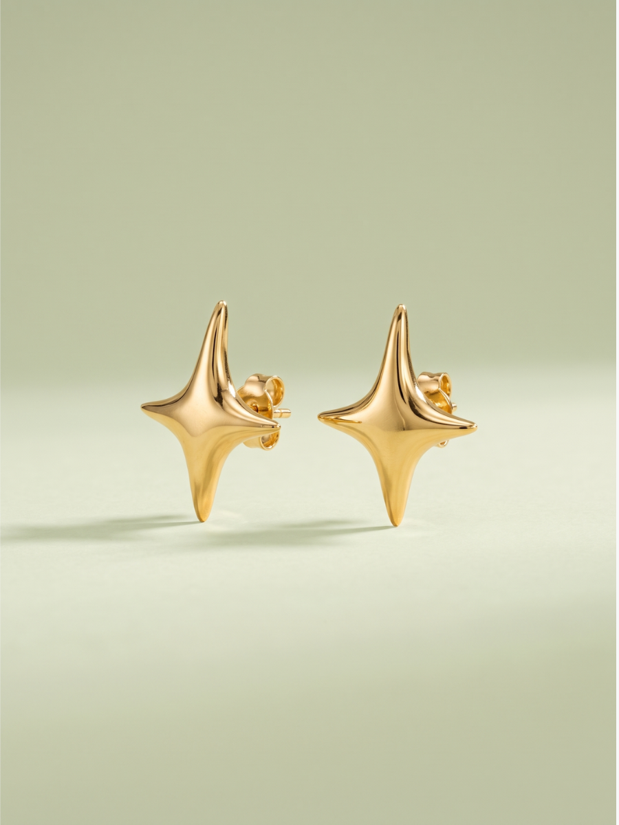 Twinkle Studs in 18K gold vermeil, polished four-point stars on a sage green backdrop