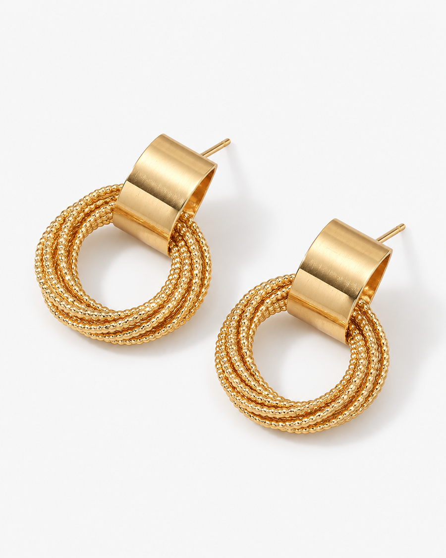 Triple Hoop Earrings in 18K gold vermeil: three textured rings hanging from a polished band