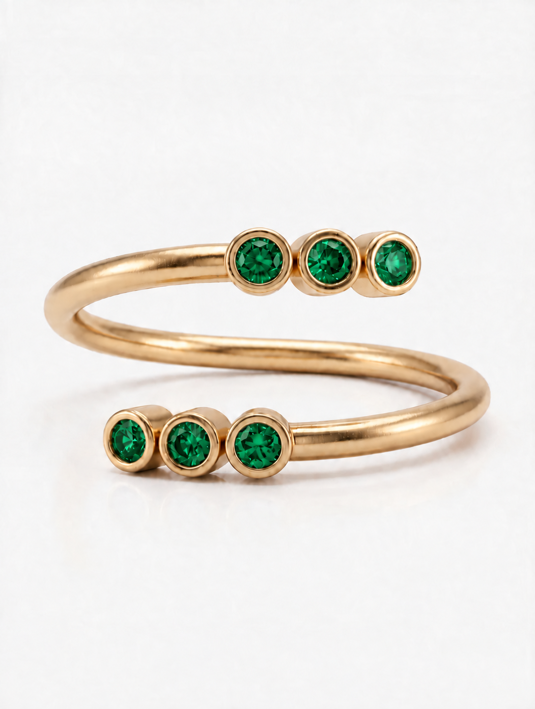 Twin Trail Ring in 18K gold vermeil with two trails of green stones on an open band
