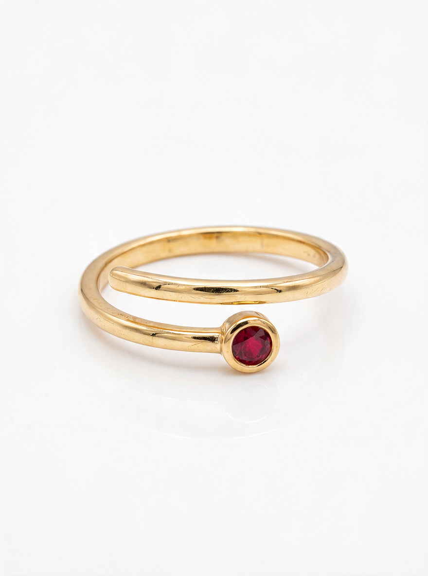Coil Ring in 18K gold vermeil with a red stone where two thin coiled bands meet