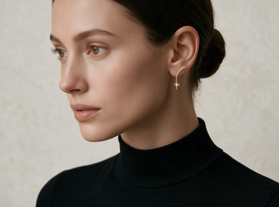 Model in a black turtleneck wearing the Shooting Star Earrings in 18K gold vermeil