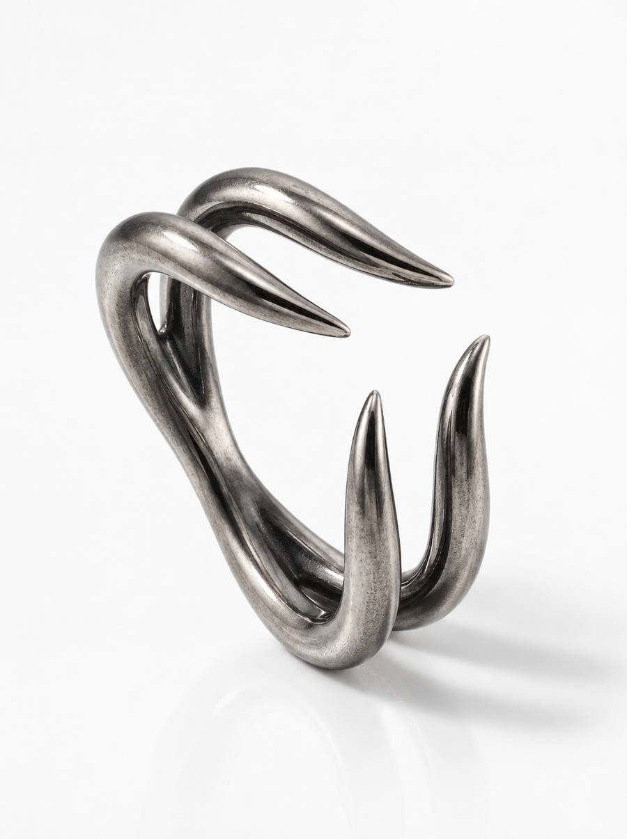 Talon Ring in oxidised silver: four curved talons curling toward each other