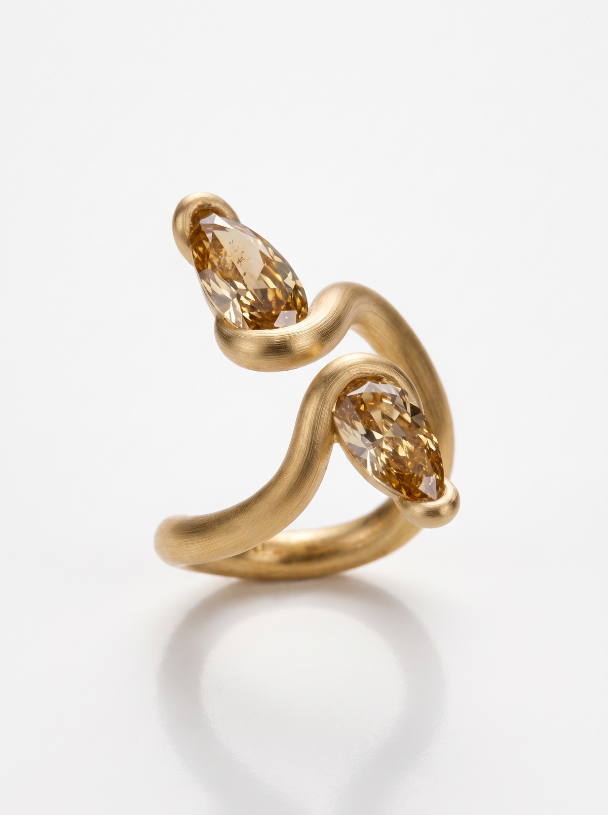 Serpent Ring in 18K gold vermeil: a coiled snake set with two warm-toned marquise stones