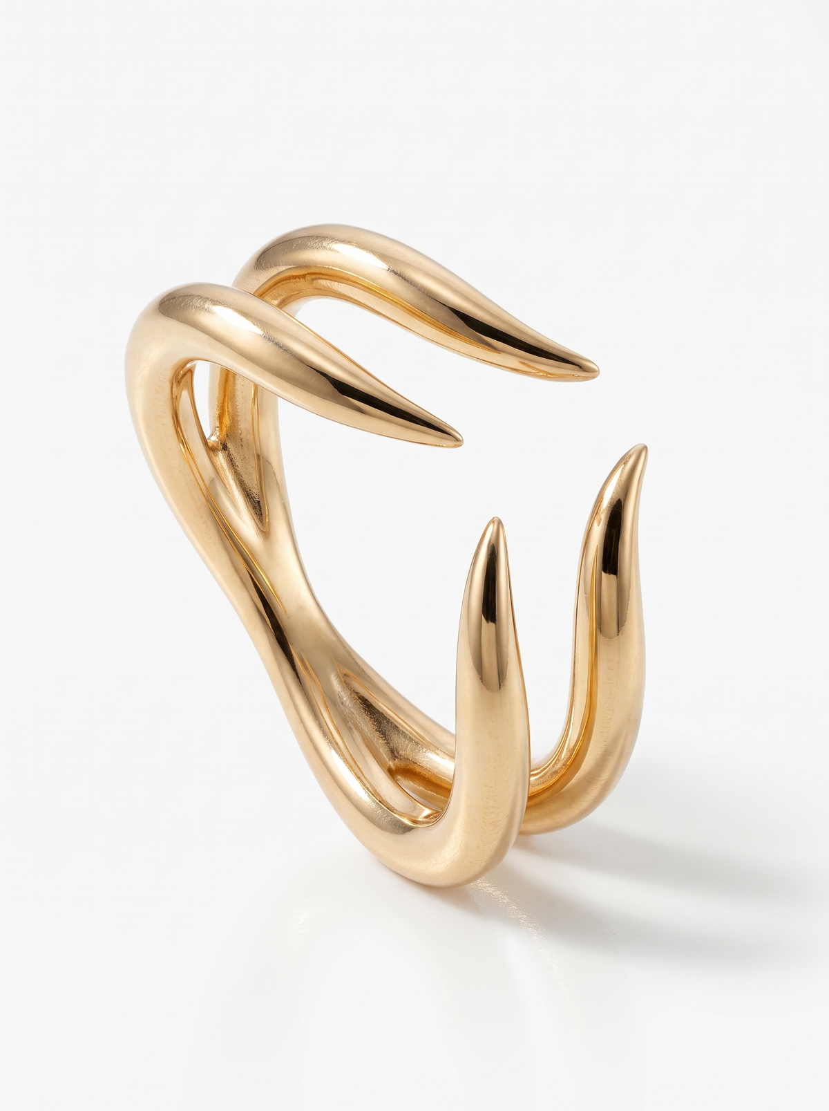 Talon Ring in 18K gold vermeil: four curved talons curling toward each other