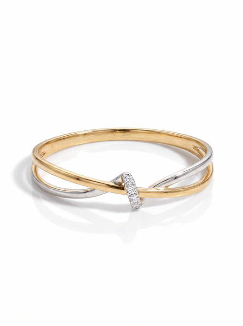 Cinch Ring in two-tone gold and silver: a twisted band pulled in at one point, traced with pavé