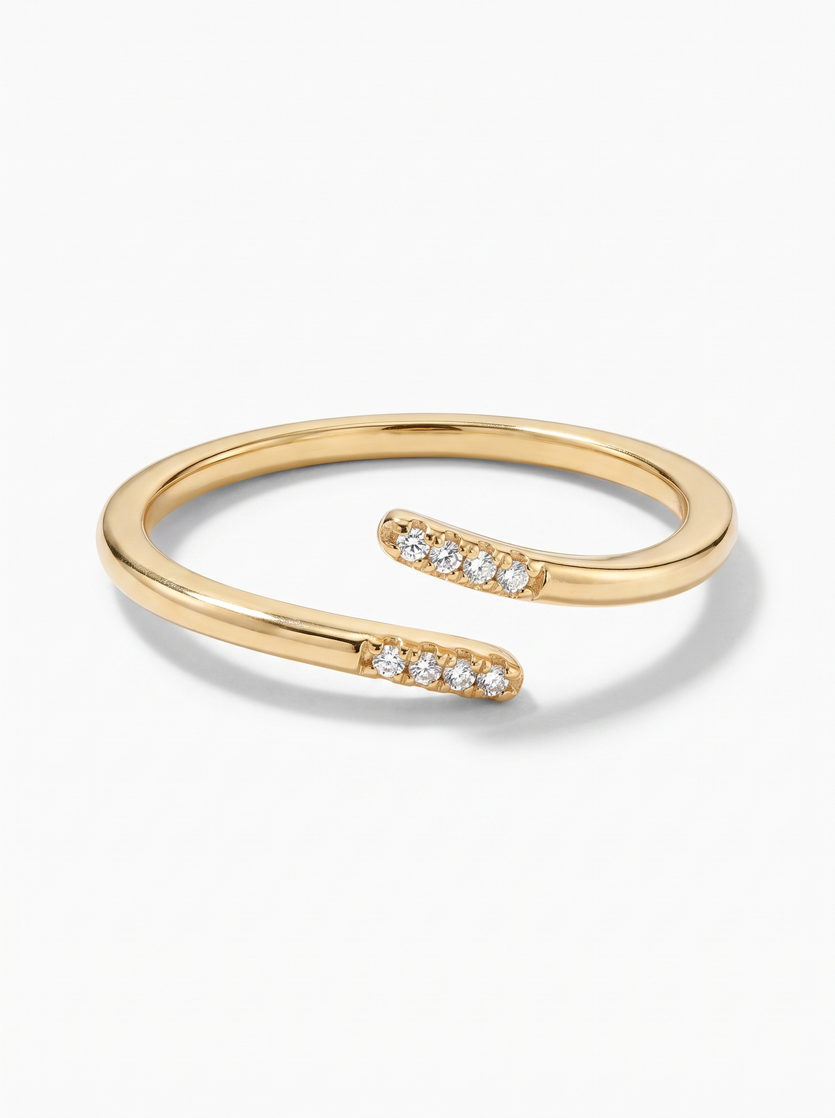 Parallel Ring in 18K gold vermeil with white stones, seen from the front on a white background