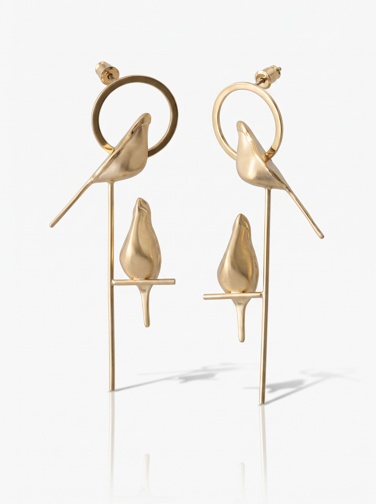 Perch Earrings in 18K gold vermeil: a small bird perched on a branch set inside a hoop