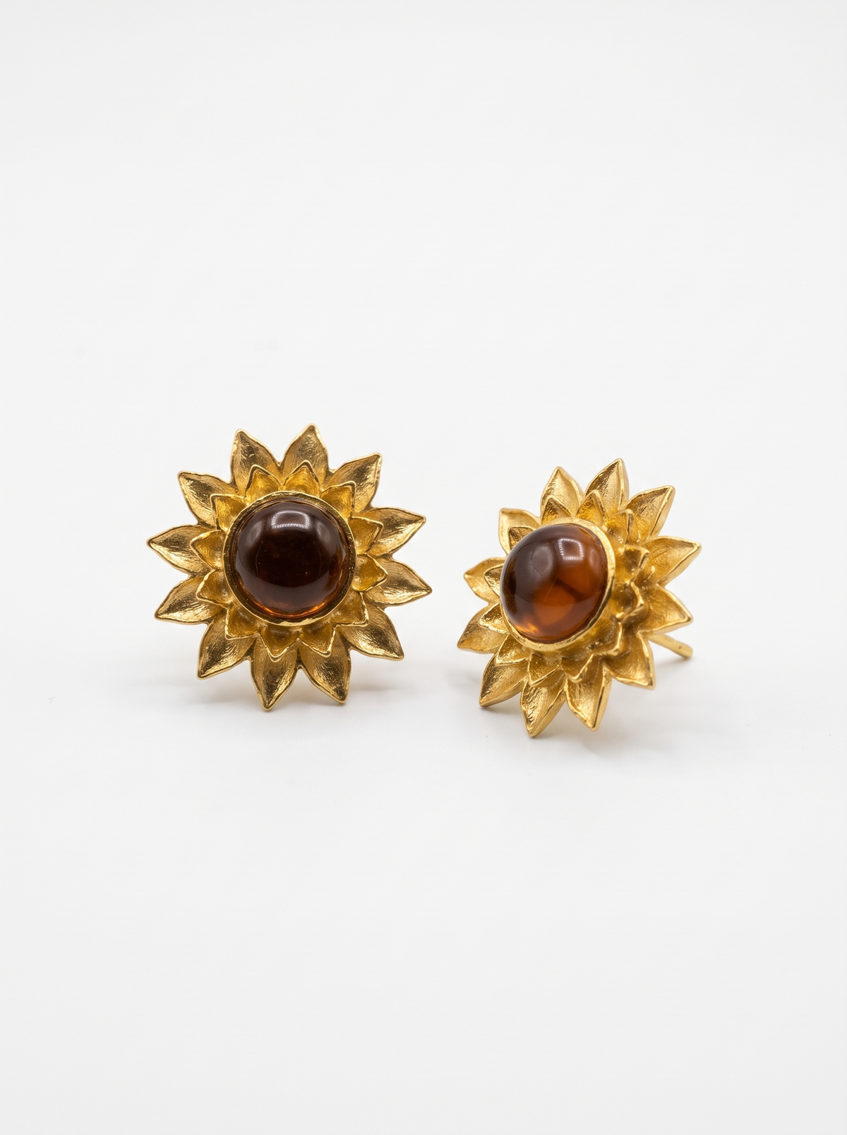 Sunflower Studs in 18K gold vermeil: layered pointed petals around a round, warm amber stone