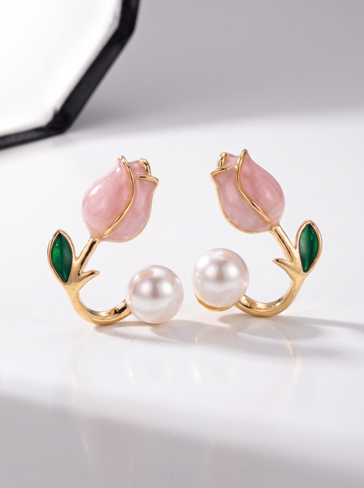 Tulip Pearl Earrings, gold-tone, angled view of the enamel tulip, leaf and pearl on each cuff