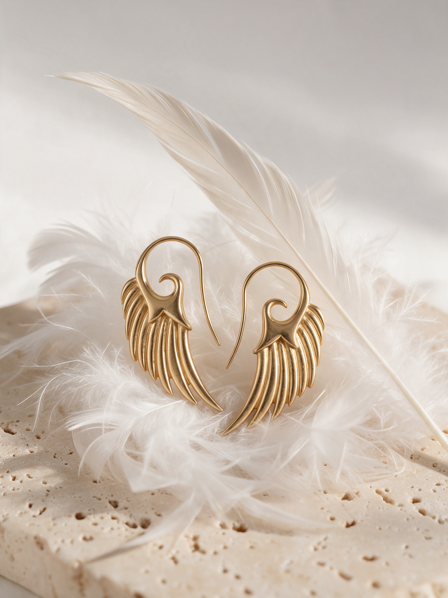 Wing Hook Earrings in 18K Gold Vermeil on white feathers