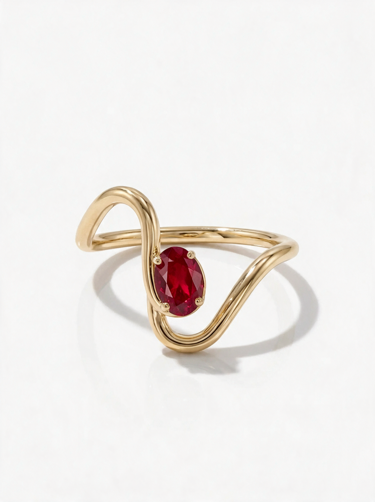 Wave Ring in 18K gold vermeil with a red stone at the peak of its wave