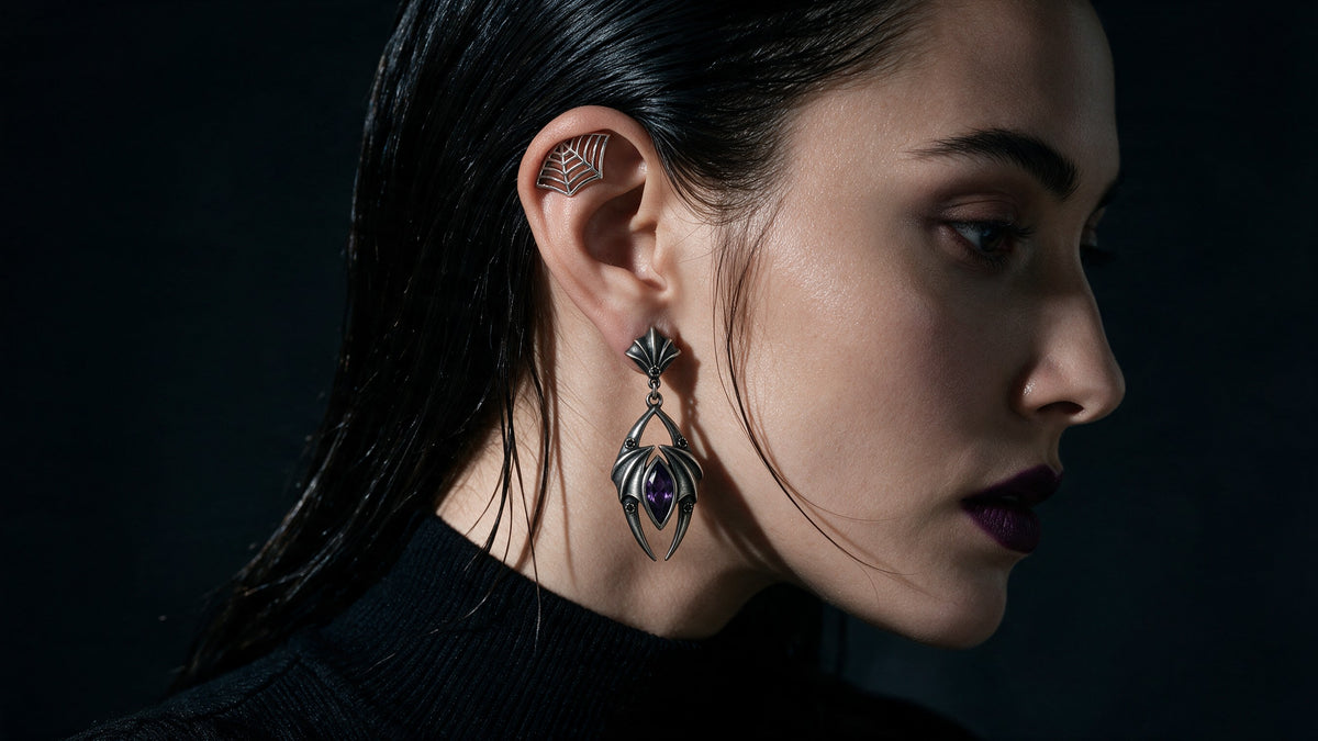 Qilver gothic earrings: bat-wing drop with a purple stone and spider-web ear cuff, oxidised silver